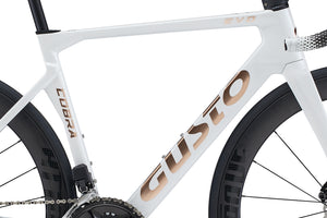 Close-up of a white bicycle frame with 'Cobra' branding.